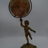 Cherub or putti carrying a globe