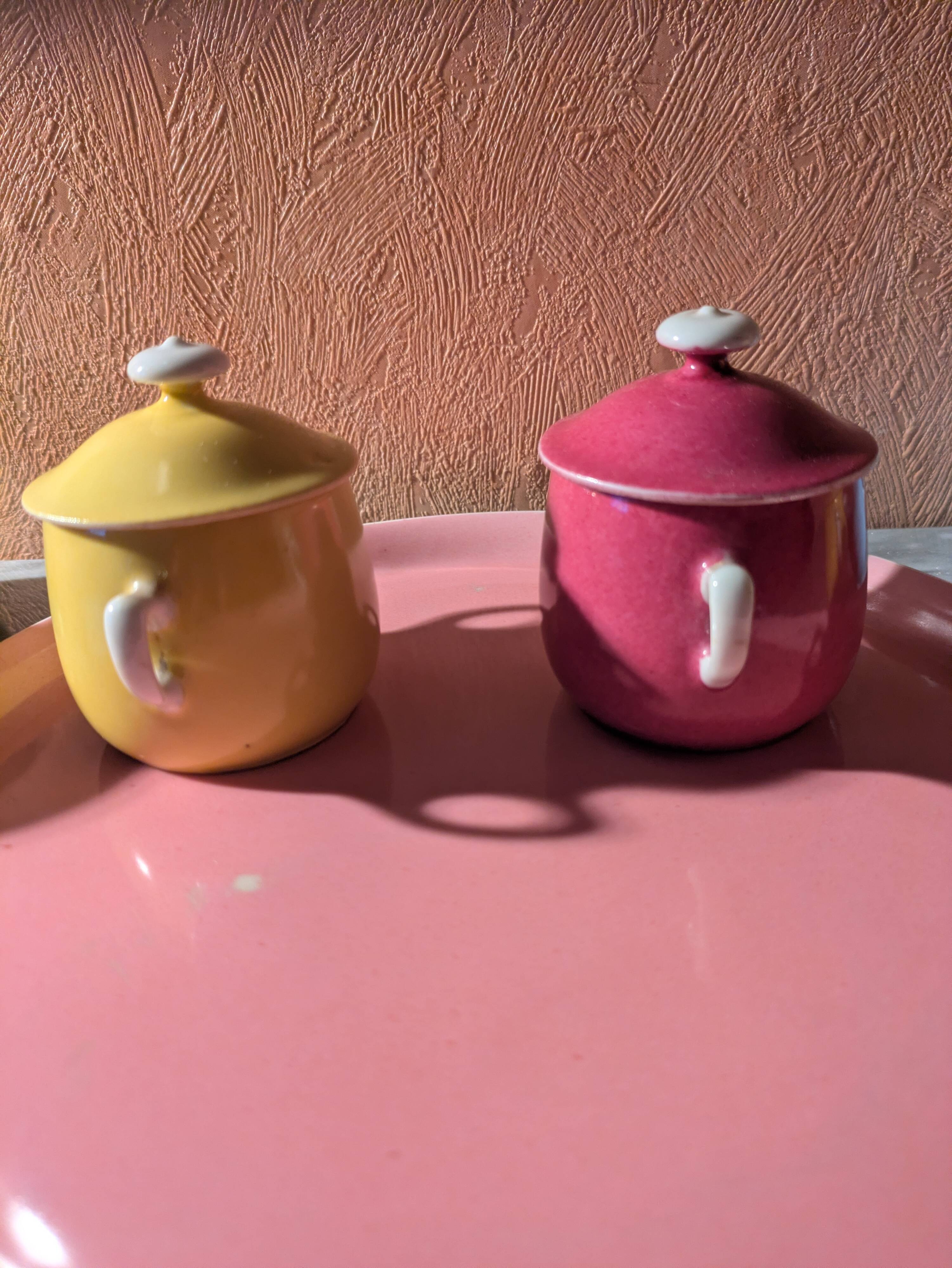 6 small porcelain cream pots from Limoges with a tray.