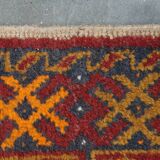 Antique oriental rug featuring orange details 135x81cm
