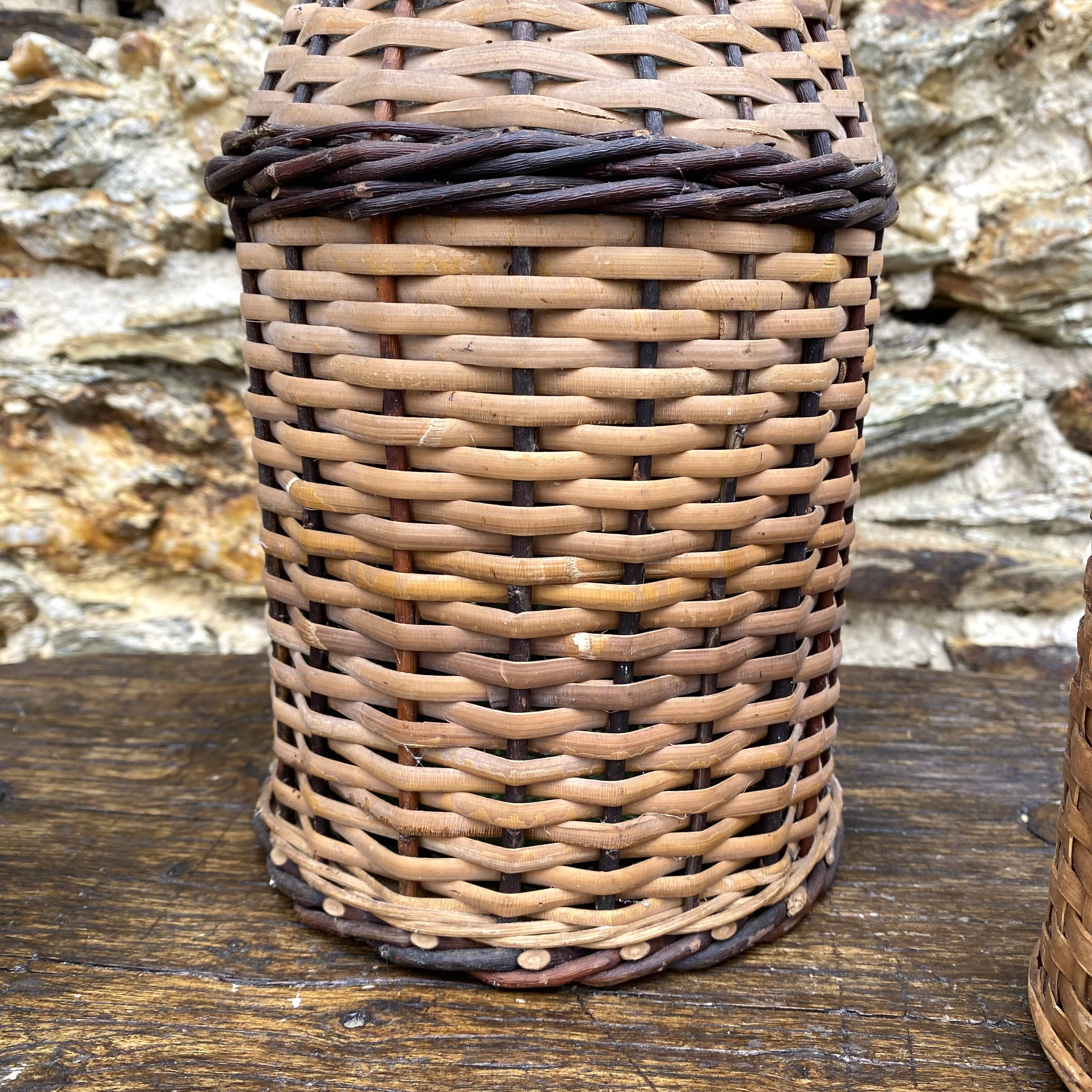 Glass bottles and rattan, woven wicker
