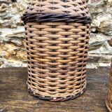 Glass bottles and rattan, woven wicker