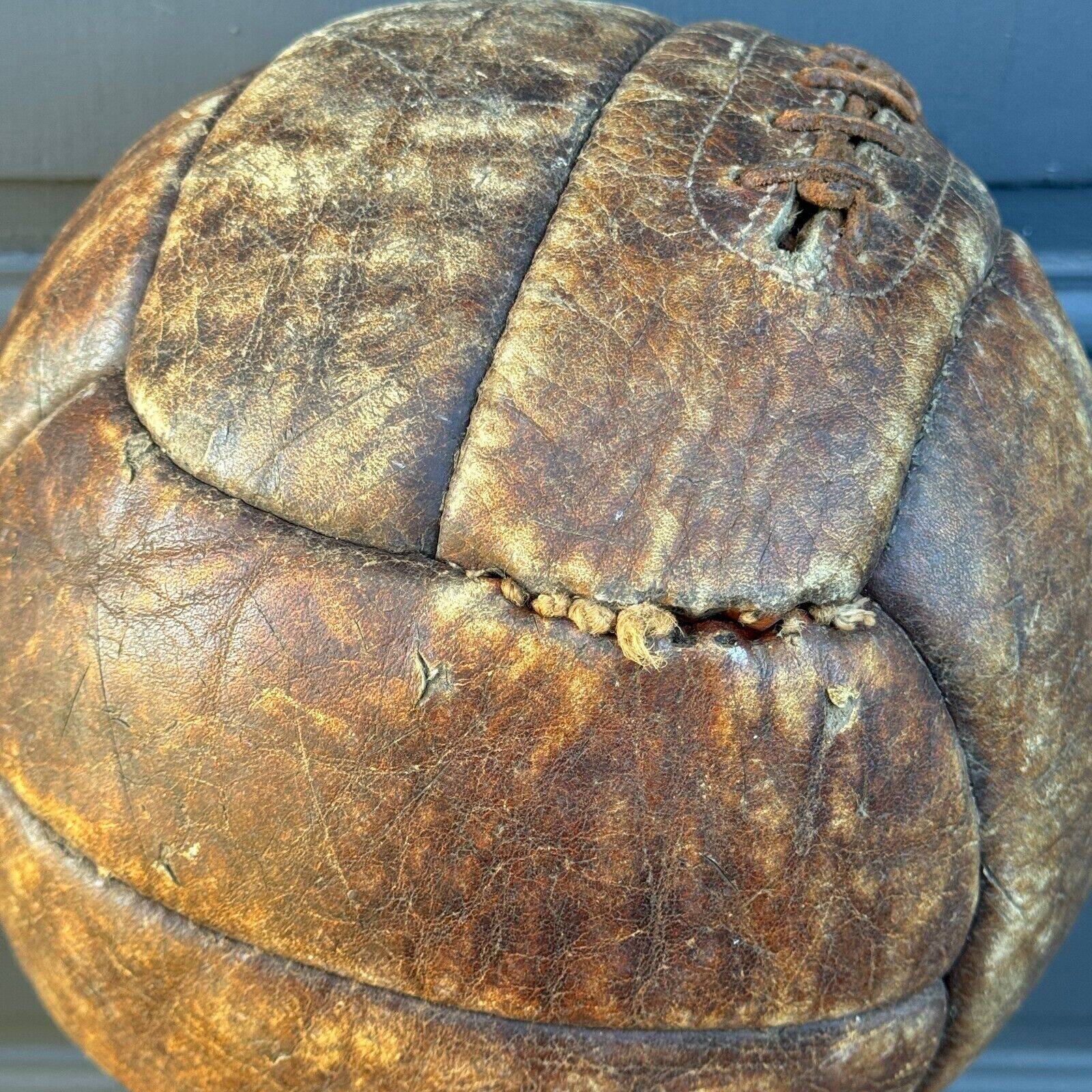 Mid-20th century leather soccer ball with visible stitching and beautiful patina