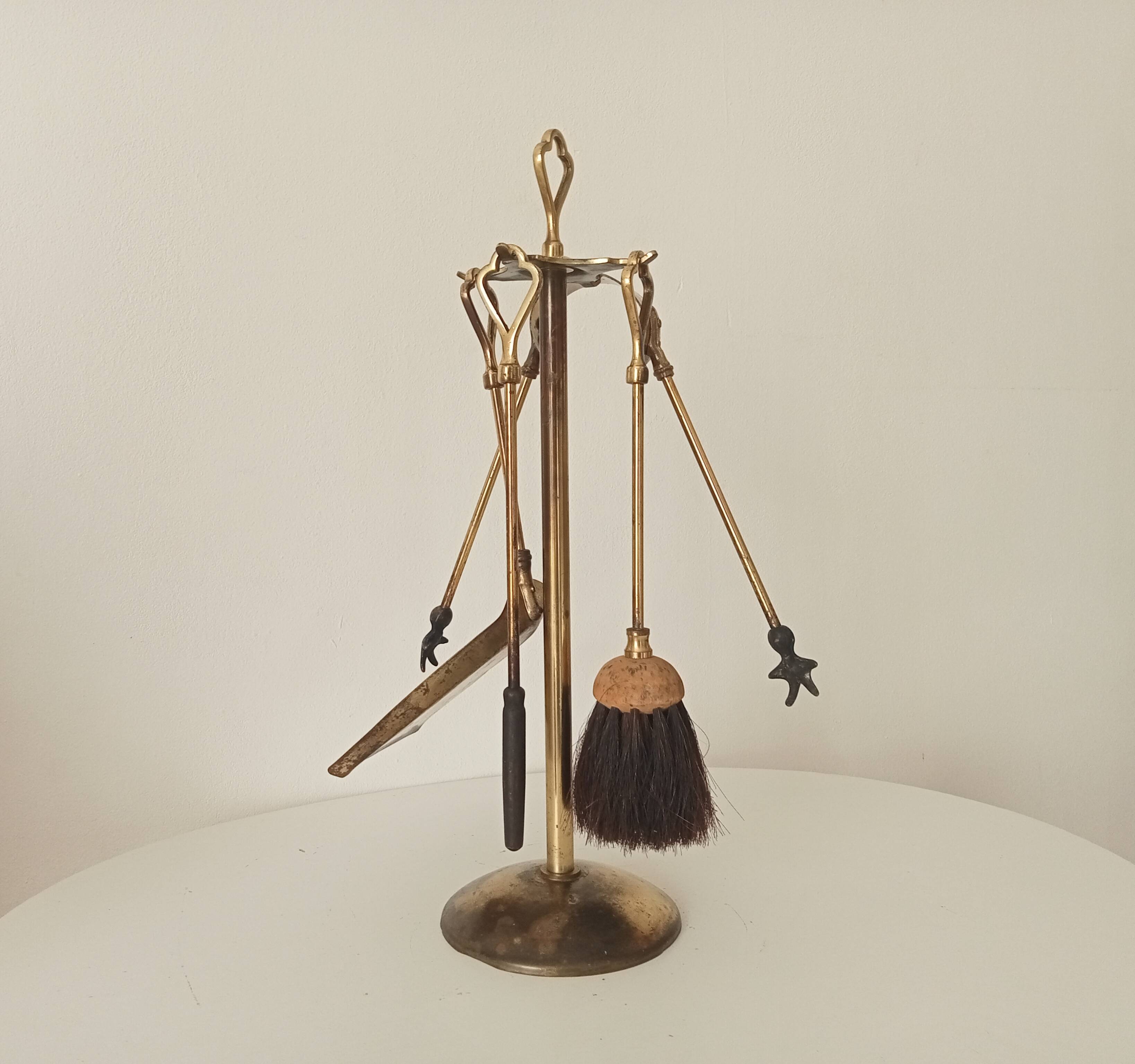 Old brass fireplace servant