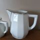 2 white porcelain milk jugs with platinum trim, Flora by Apilco.