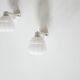 Pair of art deco porcelain and glass wall appliques