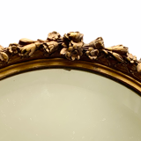 Oval mirror with flower garlands  31x45cm