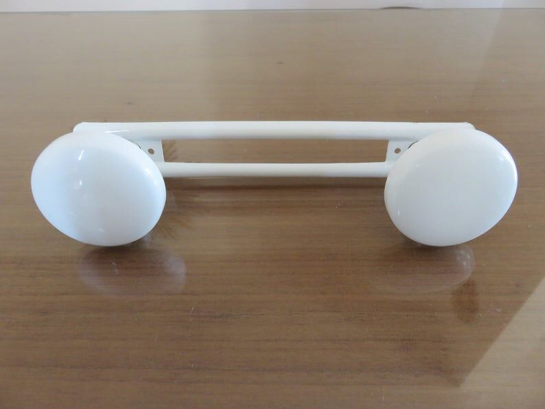 White metal coat holder in 70s