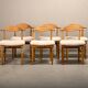 Henning Kjærnulf dining chairs set in Oak and Sheepskin, Denmark, 1960s