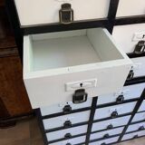 Large black and white industrial chest of drawers in pine, 40 drawers, 1950s.