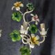 Pair of vintage painted sheet metal wall lights with flowers and foliage decor