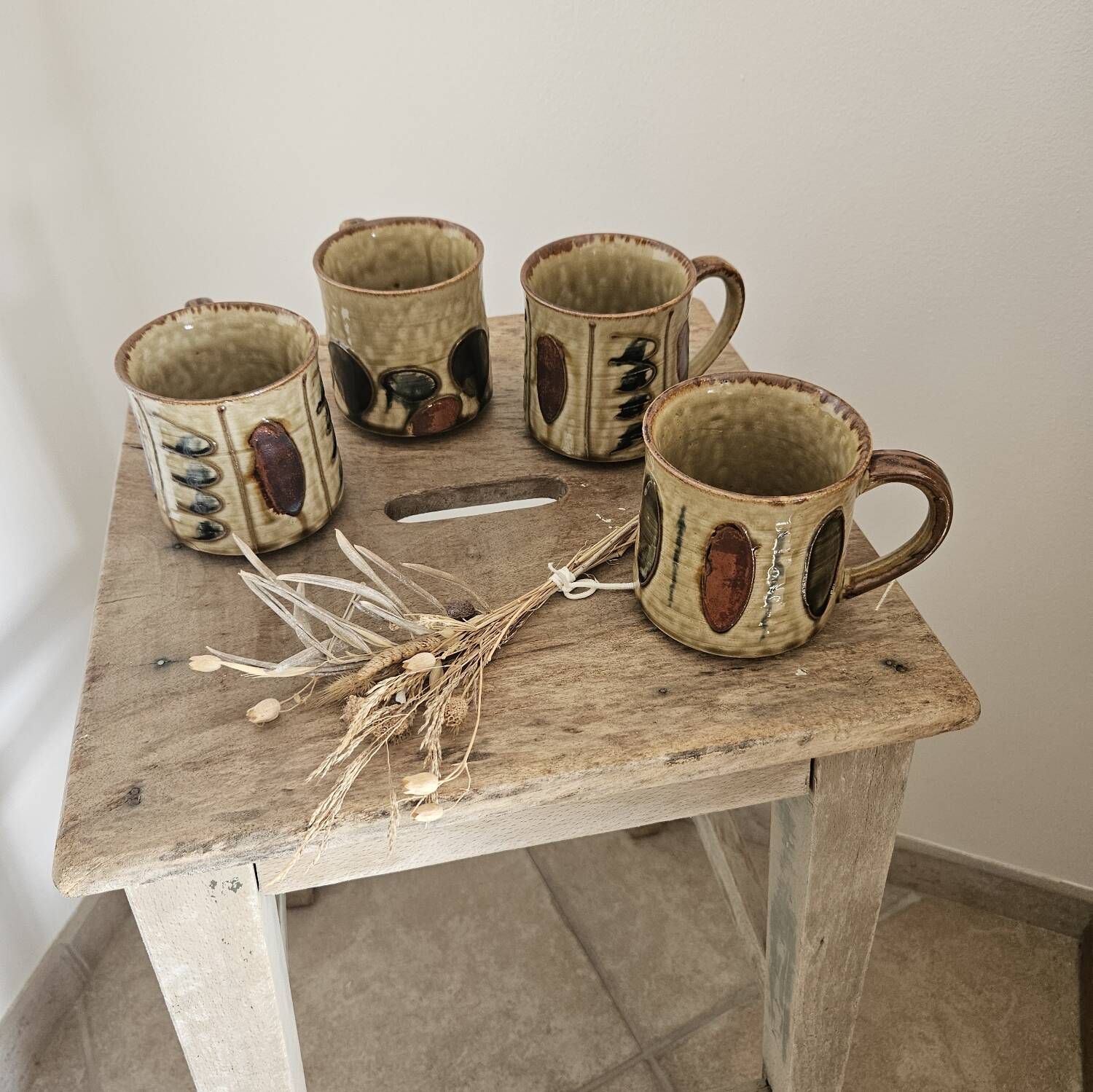 Set of 4 ceramic mugs, glazed stoneware, assorted vintage designs.