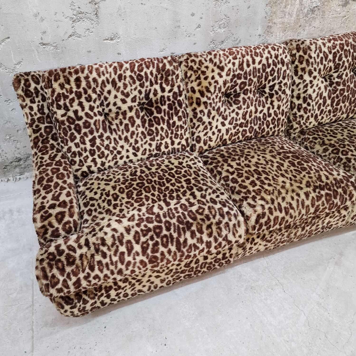 Vintage sofa in leopard fabric