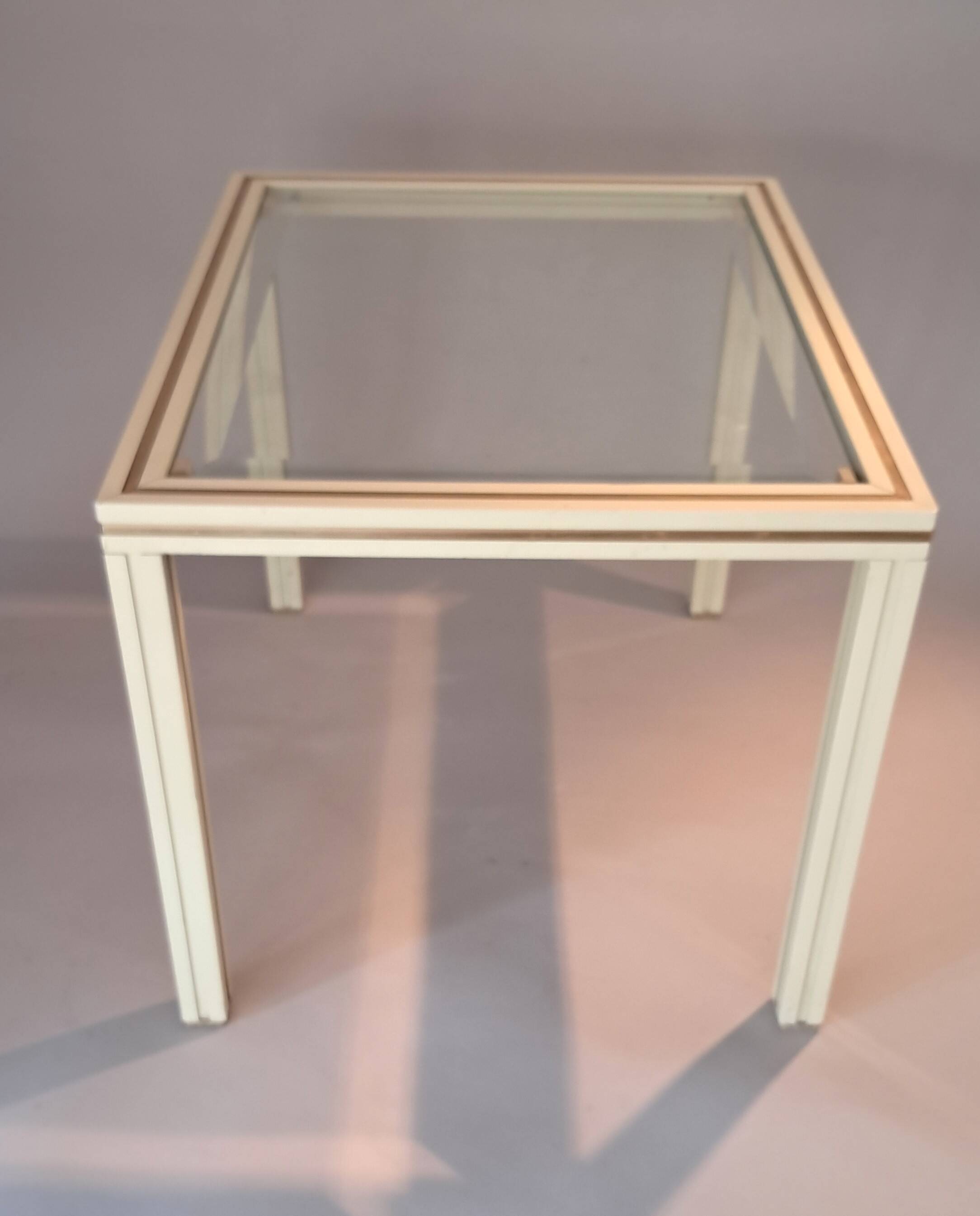 White lacquered side table by Pierre Vandel with gold brass.