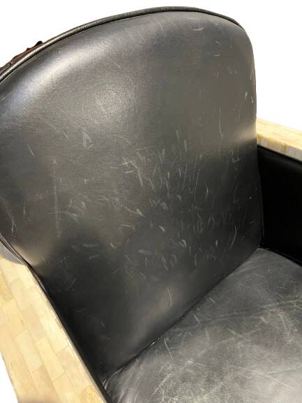 Pair of leather armchairs with marquetry armrests