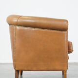 Sheep leather club chair in neutral cognac colour and in good condition