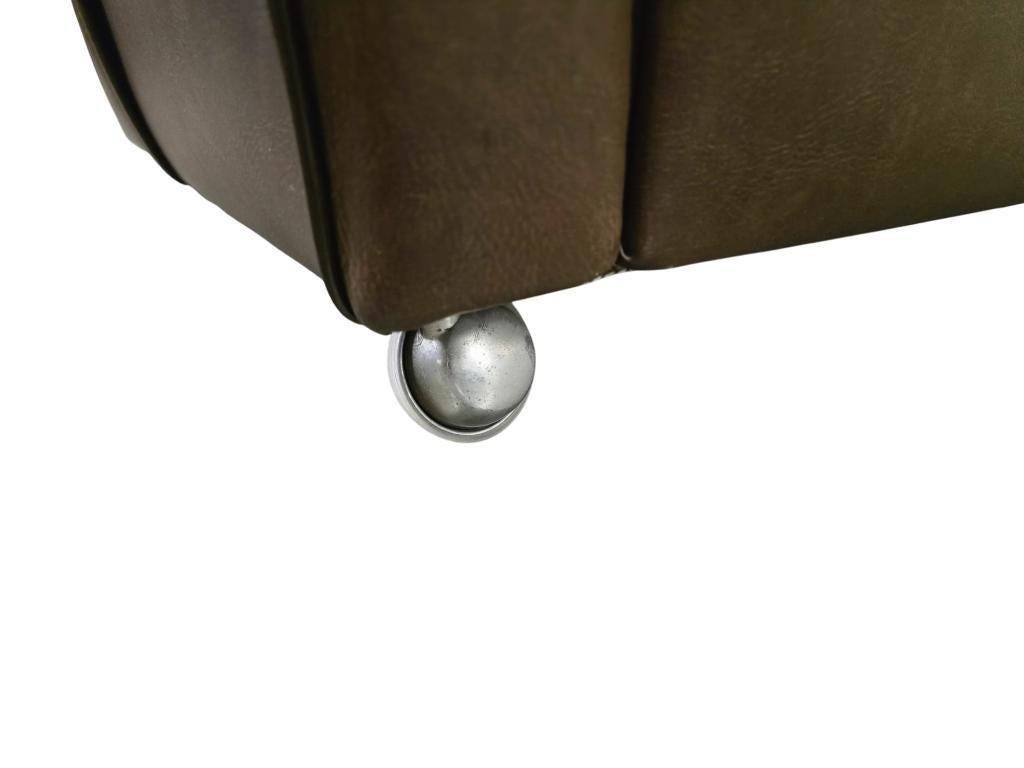 Vintage brown faux leather armchair / retro club chair on wheels