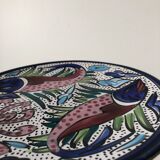 4 colorful flat plates with a fish pattern
