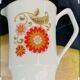 Milk jug 1970 floral pattern orange decor Laura