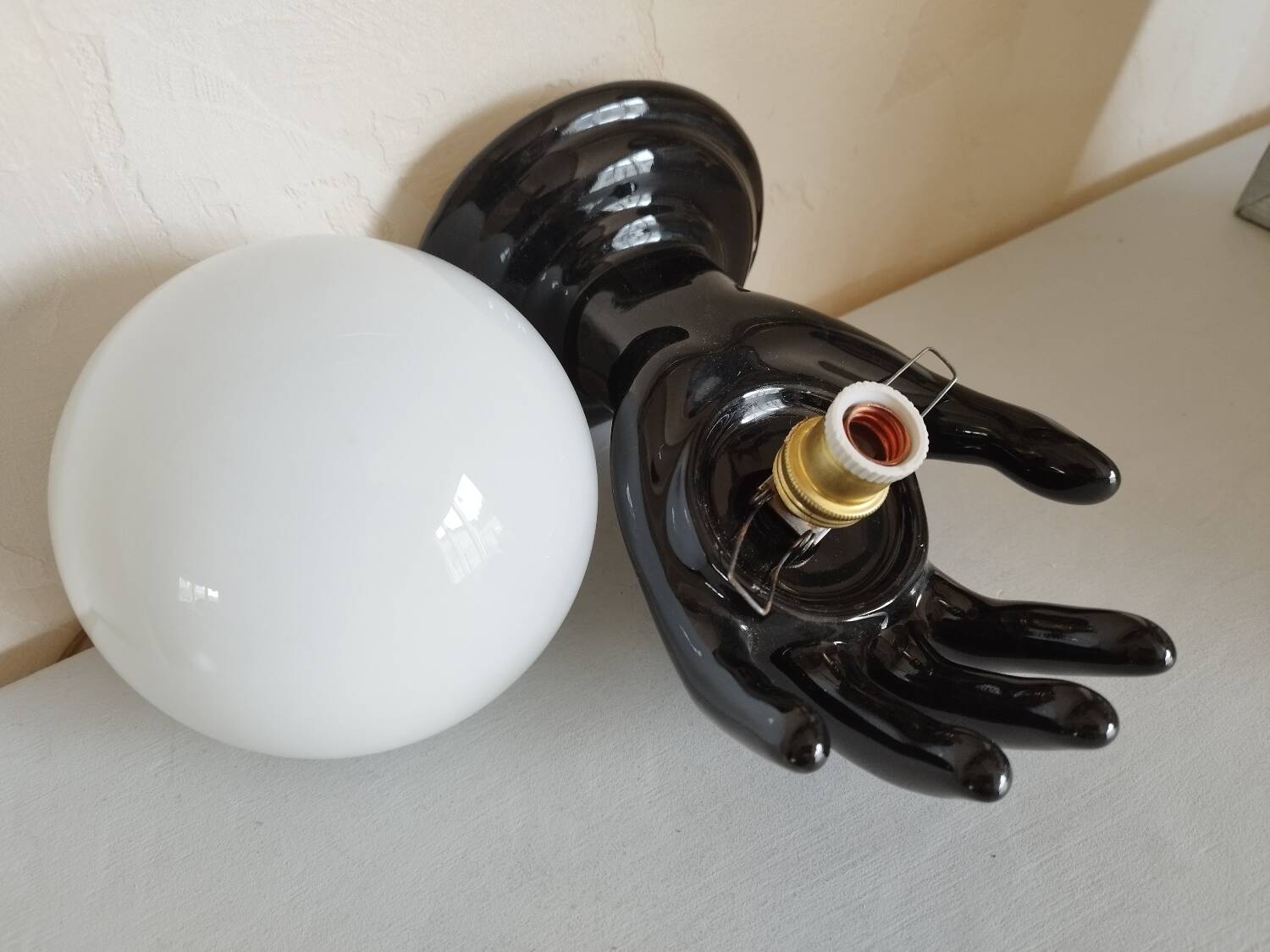 Hand-shaped wall light