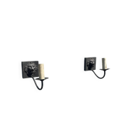 Two lion head wall sconces in tin.