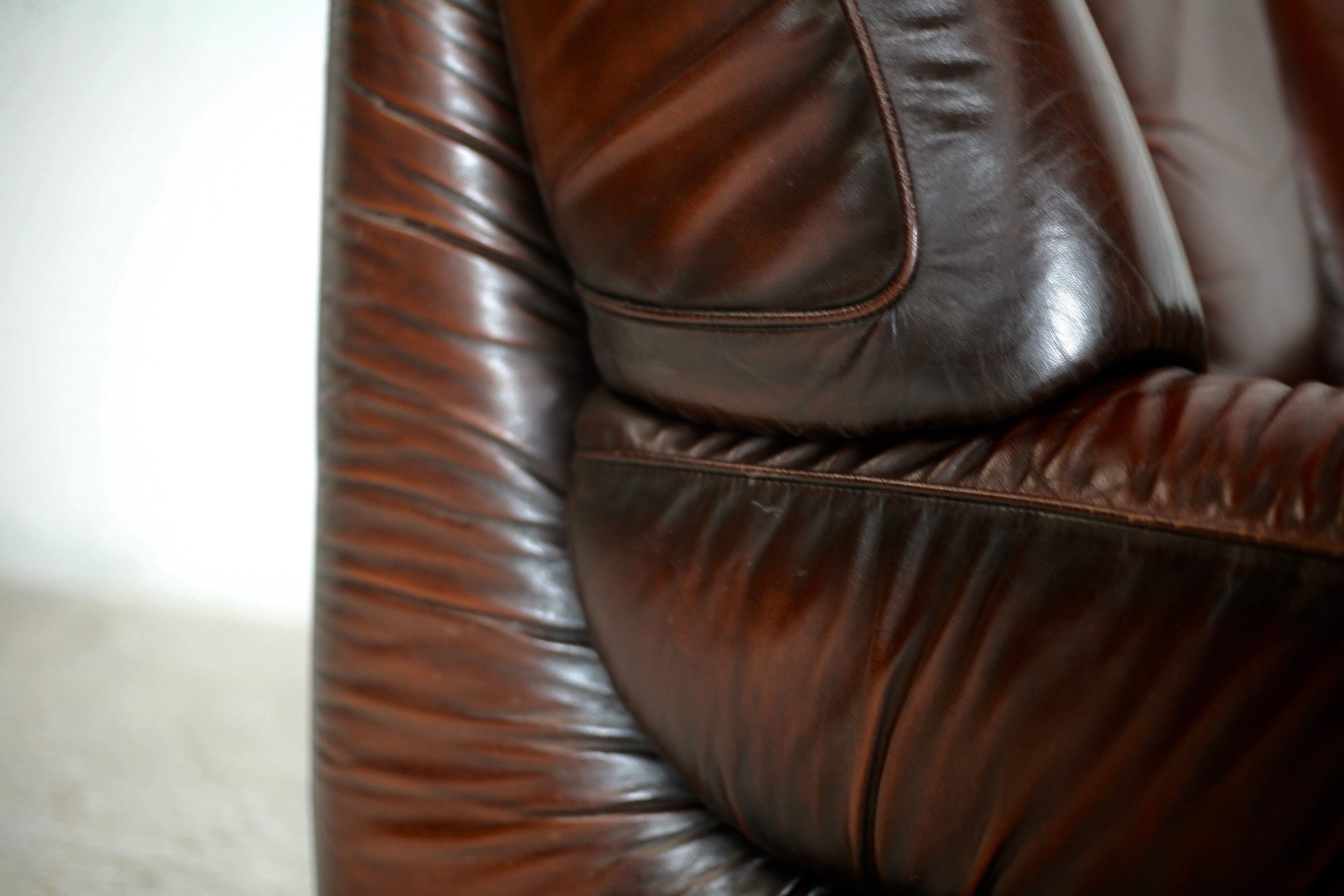 Leather armchair and coffee table set, Italy, circa 1970. Space Age