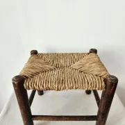 Small rustic vintage wooden and straw stool -