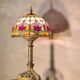 restored antique Art Nouveau bronze lamp, stained glass lampshade in Tiffany style
