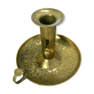 Brass candlestick with rise and fall
