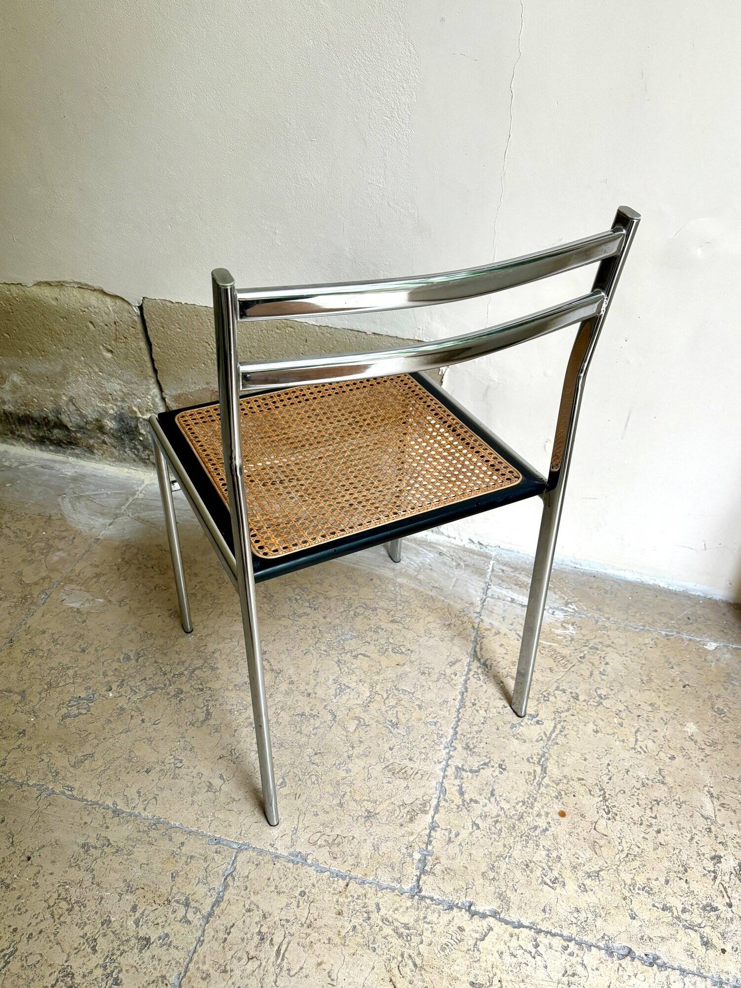 Chair in chrome metal, black wood and canework