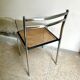 Chair in chrome metal, black wood and canework