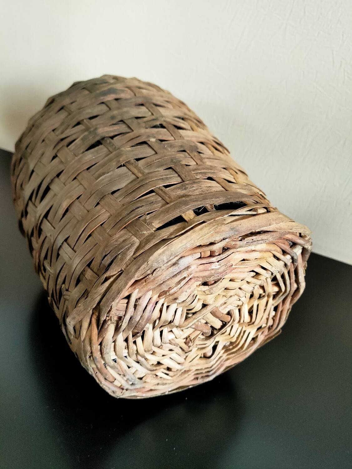 Antique demijohn made of glass and woven wicker
