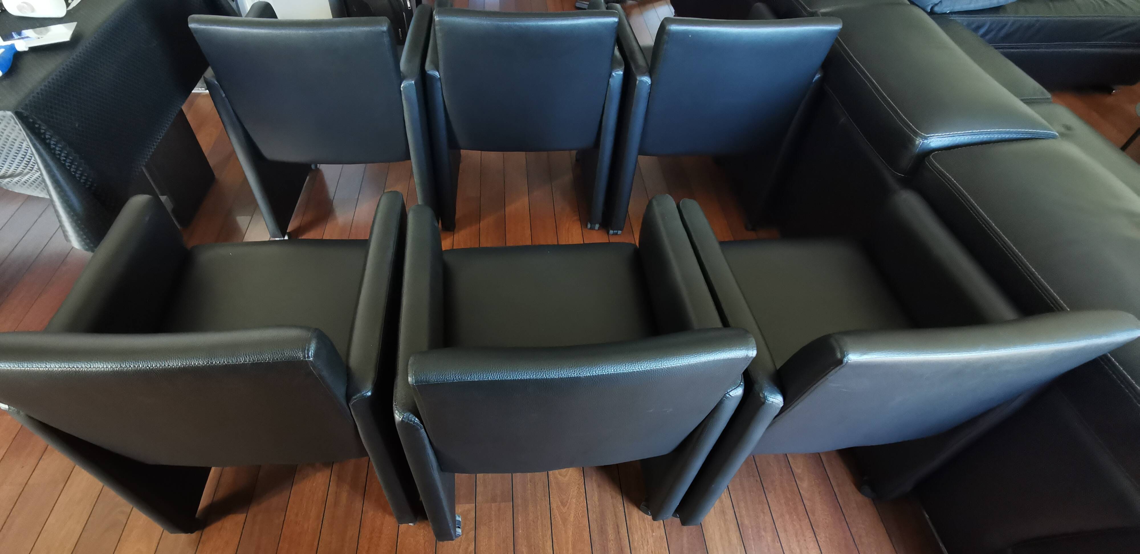 6 faux leather chairs on wheels