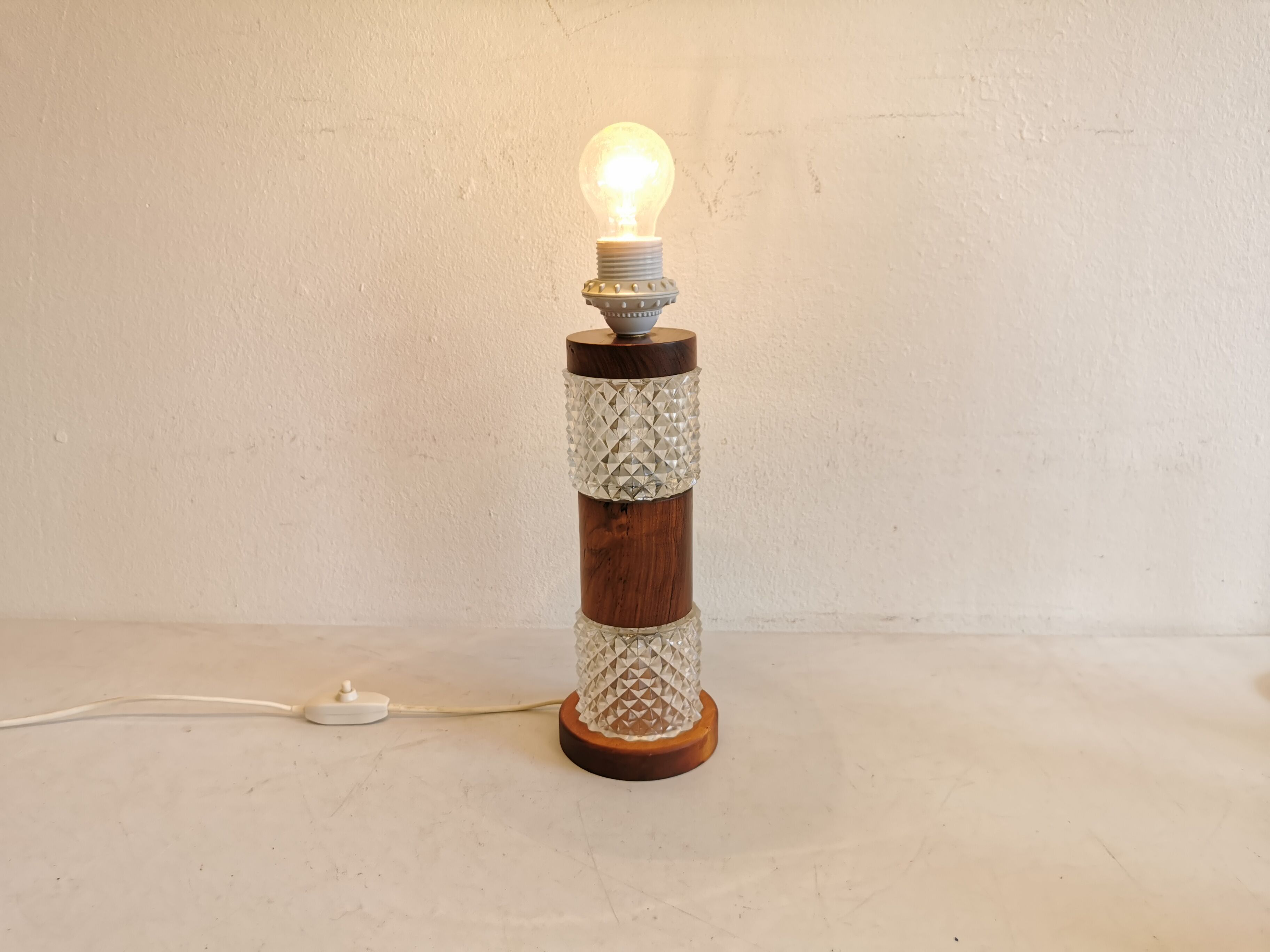 Swedish table lamp, made of what looks like rosewood and crystal glass.