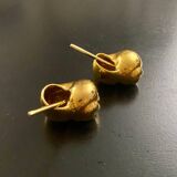 2 Snail-shaped salt pots in gold-colored porcelain