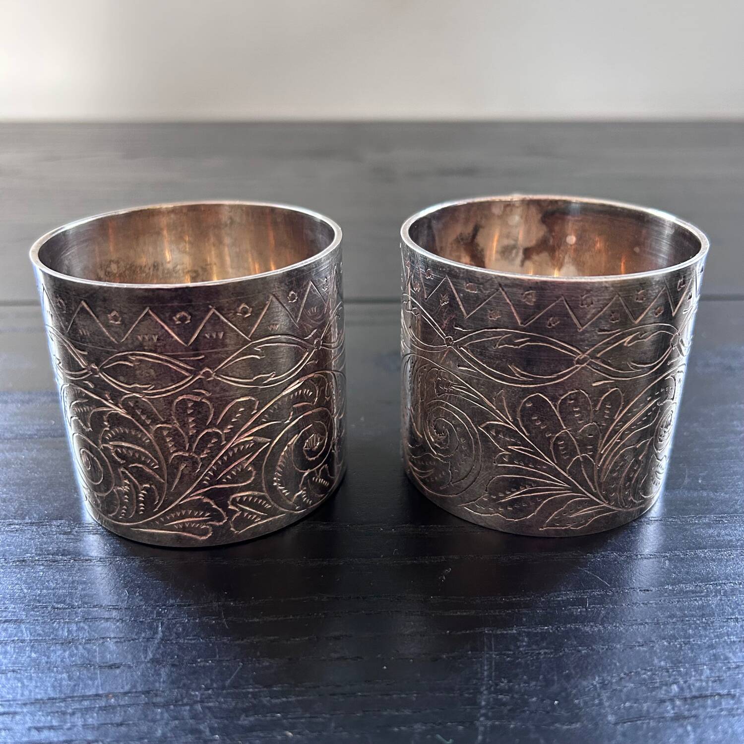 Pair of chiseled silver cups