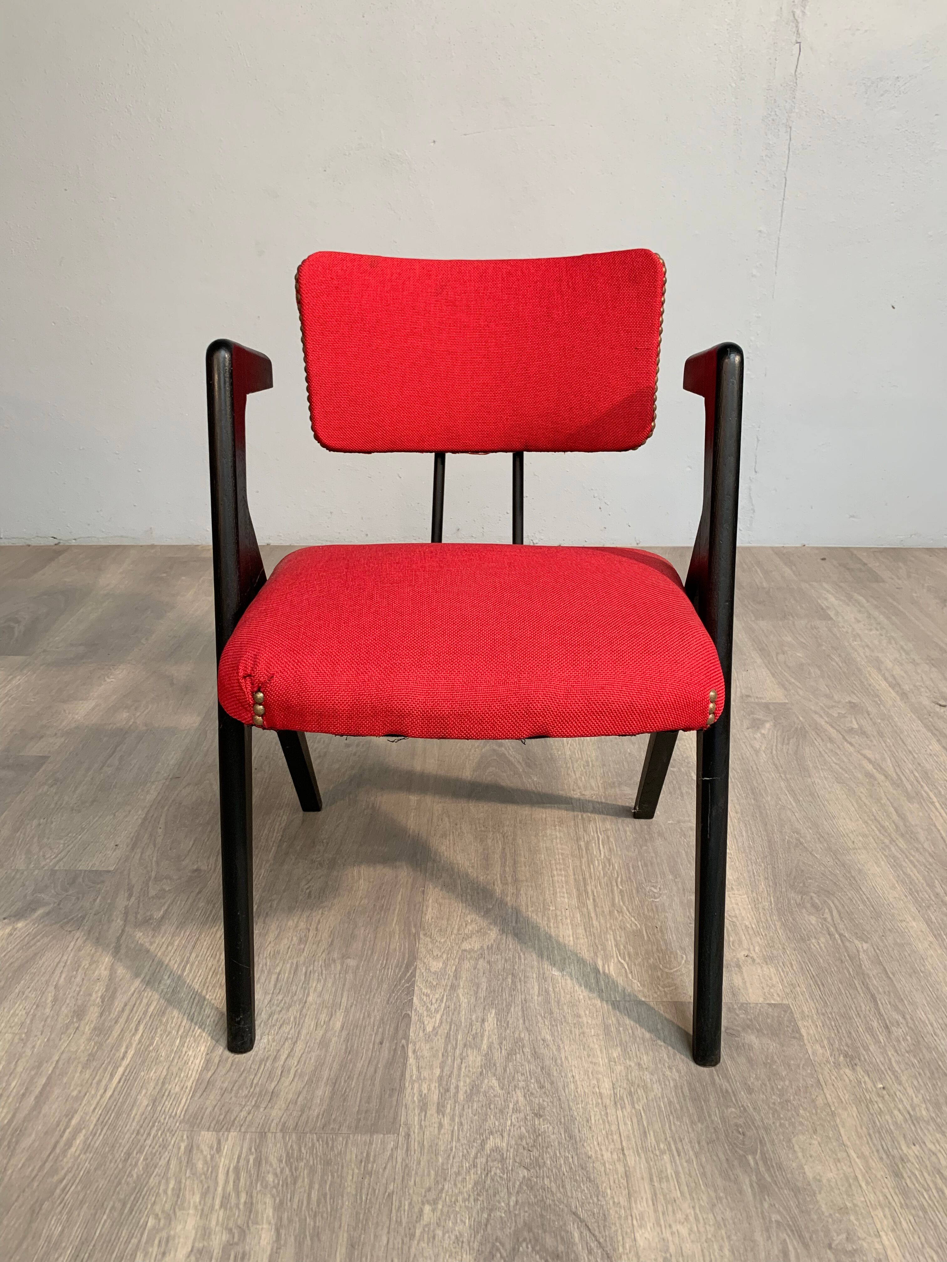 Red fabric chair with black base