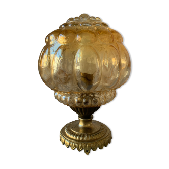 Old vintage table lamp made of amber molded glass
