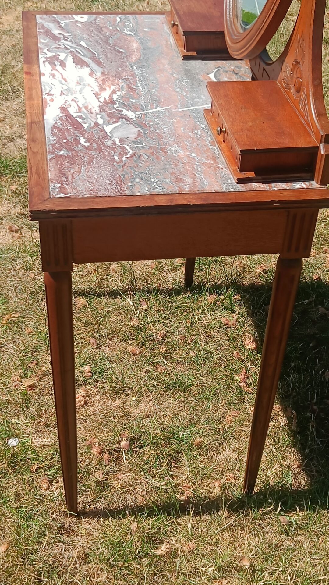 Art Deco oak dressing table, marble top and swivel mirror.