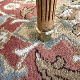 Round dining table with leather top in Louis XVI style.