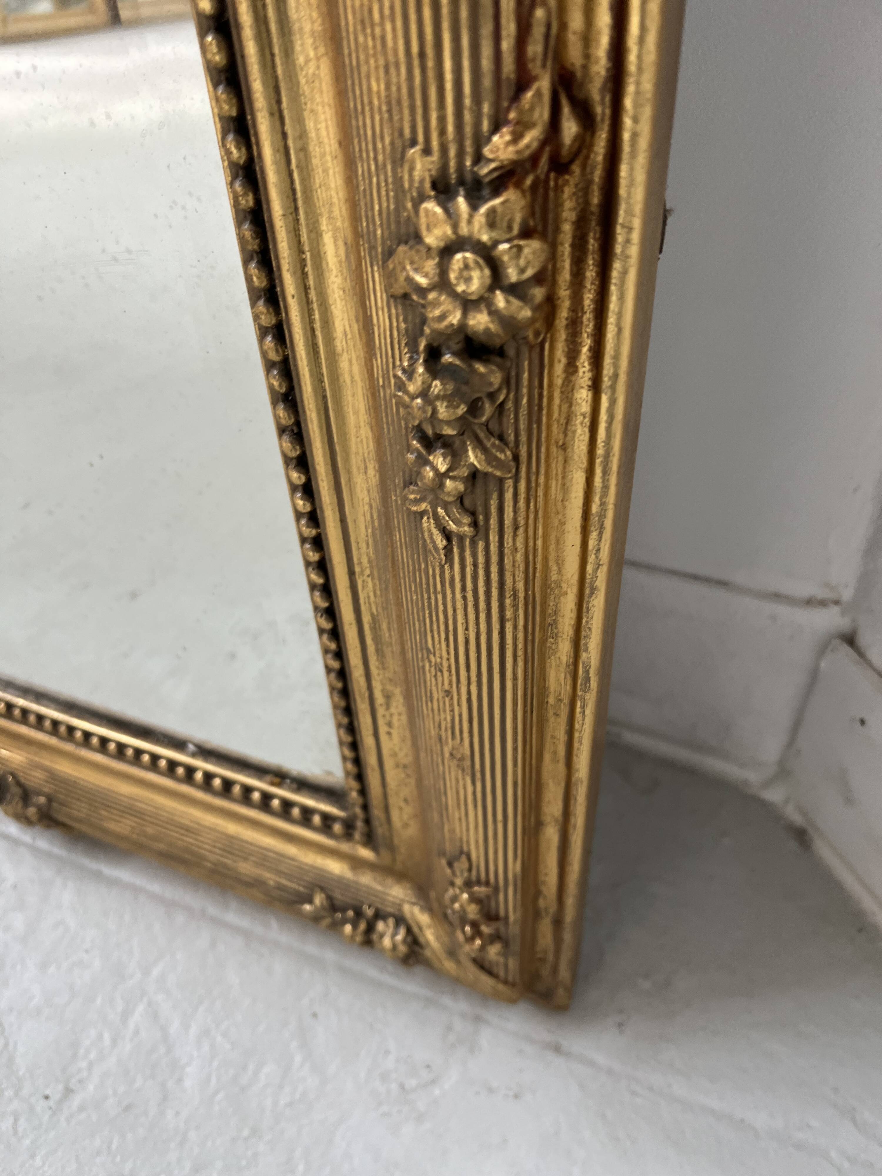 Louis XVI style mirror in wood and gilded stucco, 19th century