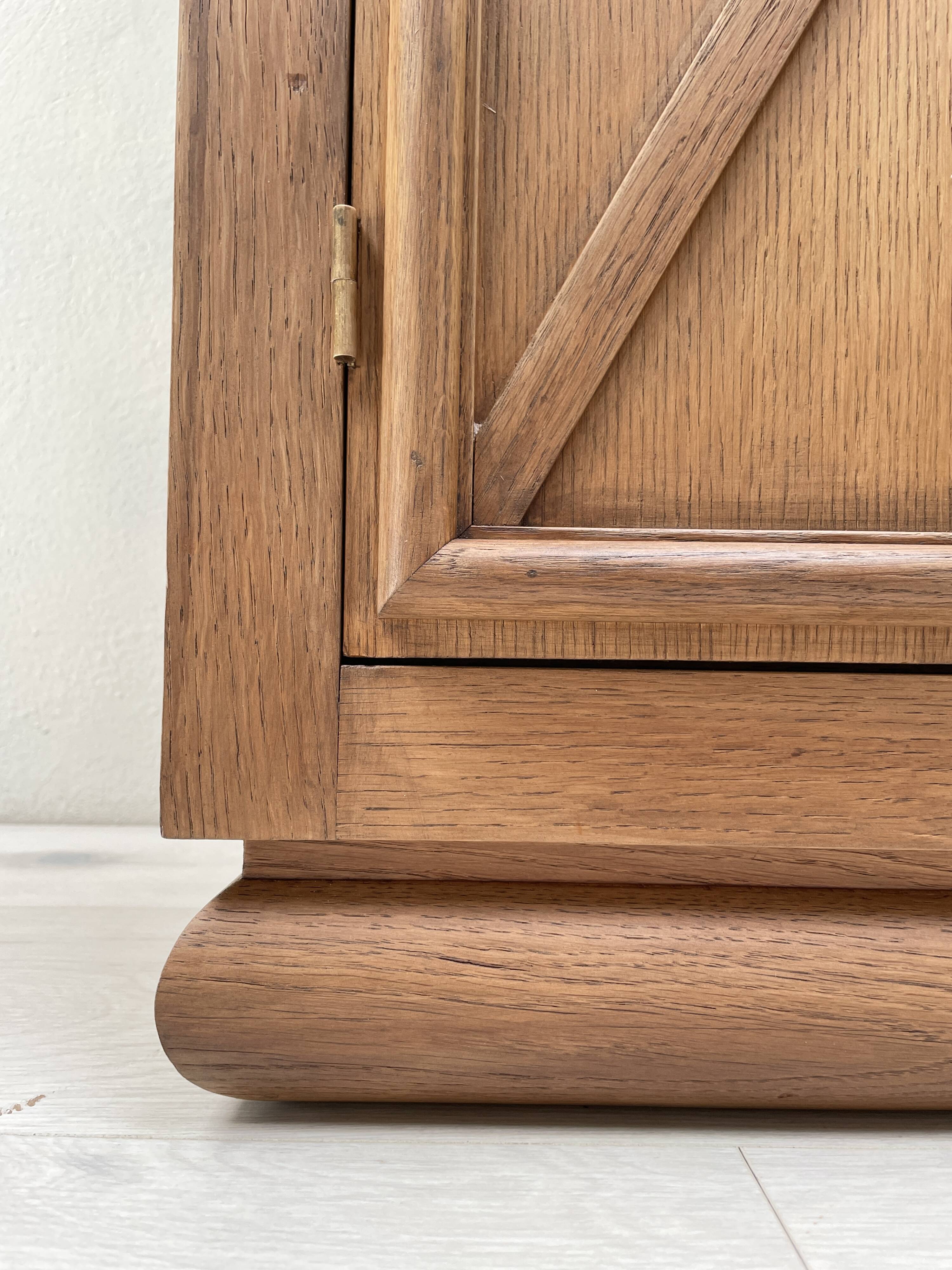 Storage unit in solid oak and veneer, circa 1960.