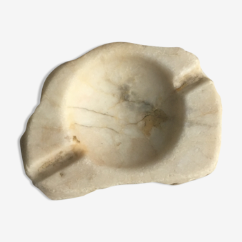 White marble ashtray with a raw appearance
