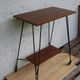 Tv furniture, a table with teak wheels and Scandinavian-style metal.