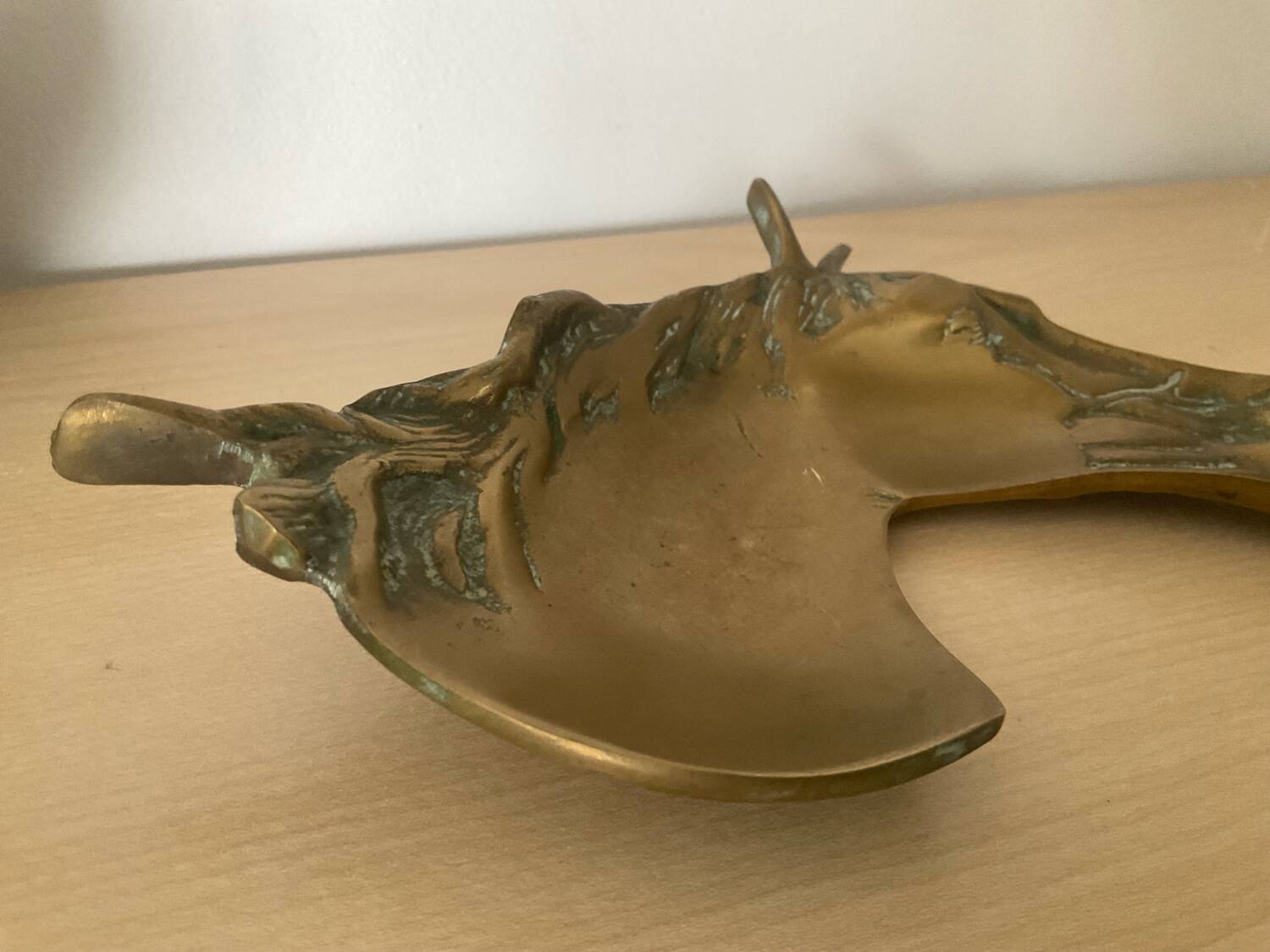 Vintage bronze horse pocket emptier