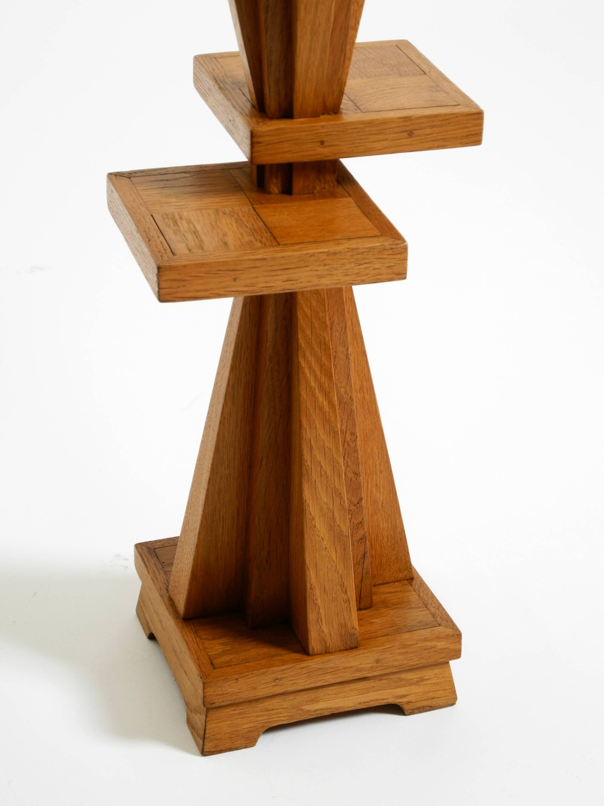Two mid-century standing ashtrays consisting of red Alabaster cup