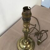 Brass candlestick mounted in lamp