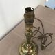 Brass candlestick mounted in lamp