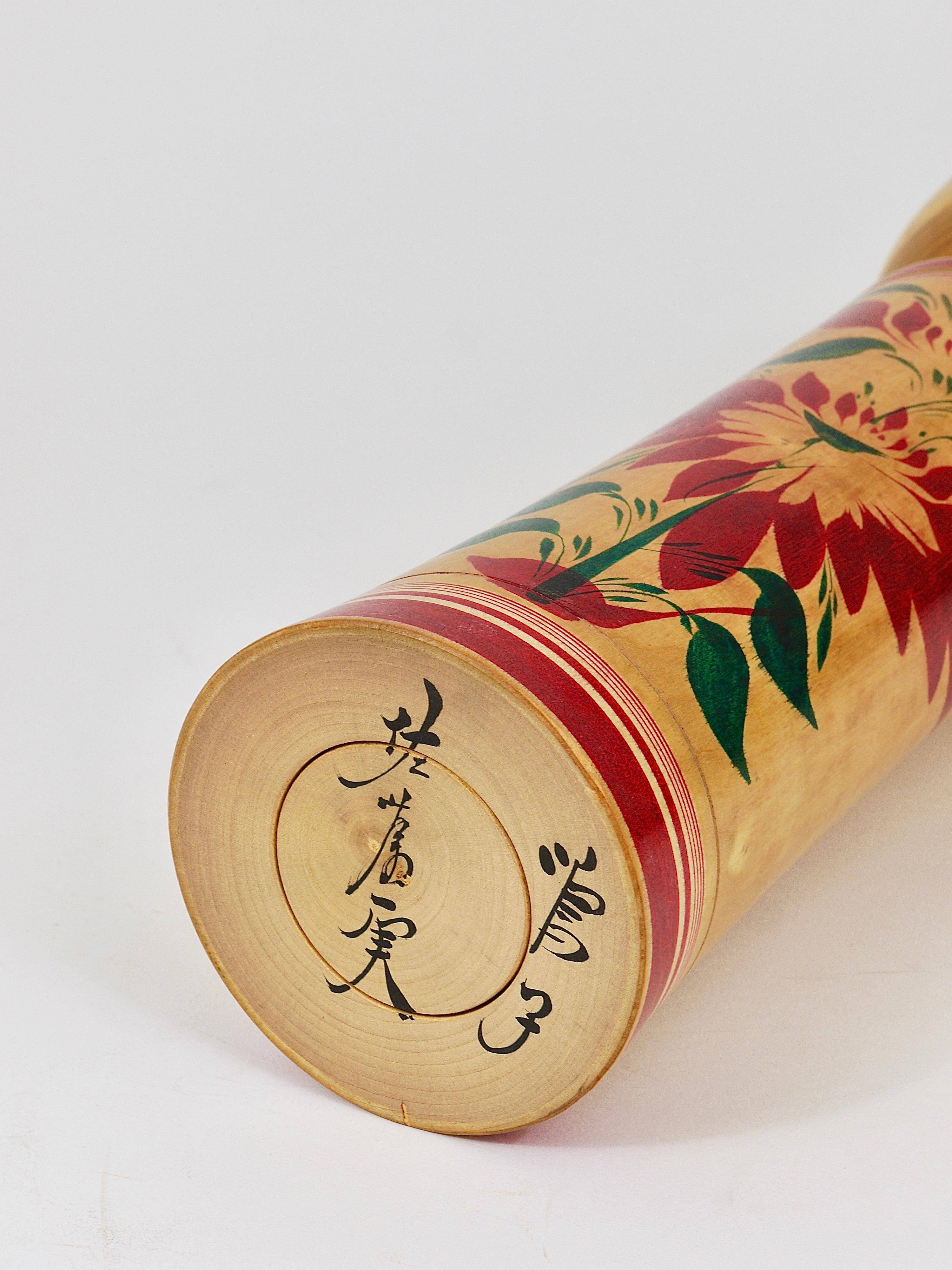Decorative Naruko Kokeshi doll sculpture from northern Japan, hand-painted.