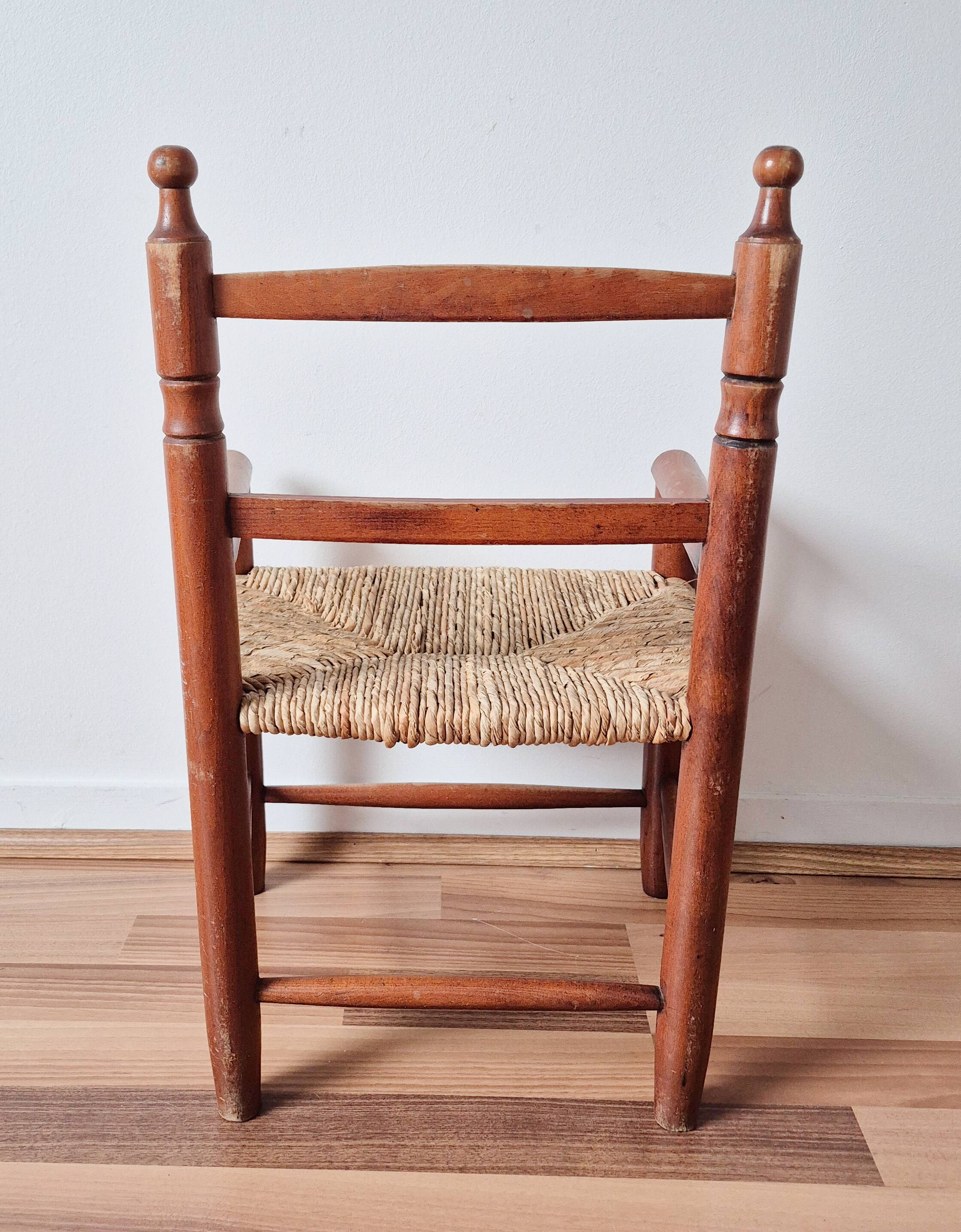 Vintage wooden and straw children's armchair