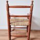 Vintage wooden and straw children's armchair